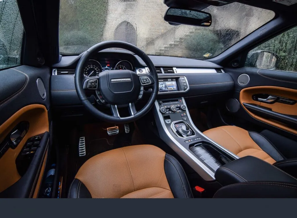 Luxurious rear seating in a Range Rover with leather upholstery, offering the highest level of comfort for passengers traveling in London.
