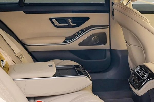 Spacious and luxurious back seat area of a Mercedes-Benz S-Class, featuring fine leather and premium comfort for elite travel in London.